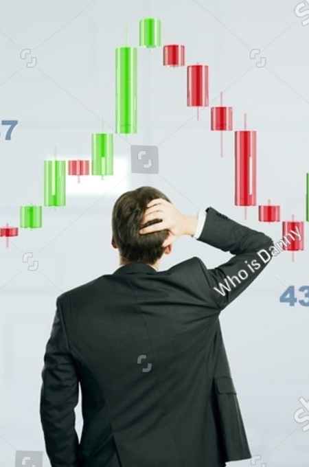 stock-photo-businessman-in-suit-analyzing-candlestick-chart-data-red-and-green-bars-on-light-blurred-2580016599